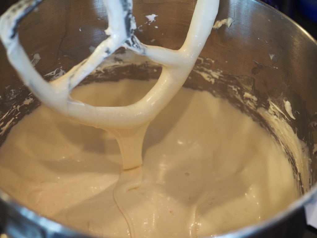 A gooey, gloopy marshmallow frosting in a mixer. 