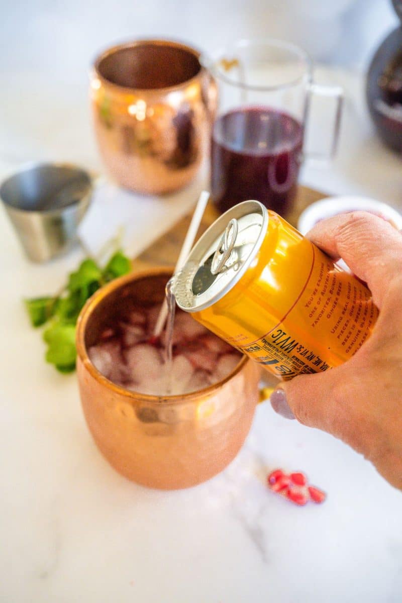 Adding ginger beer to holiday mule. 