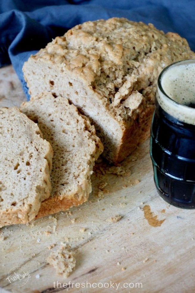 sliced beer bread with a mug of dark beer | via @thefreshcooky