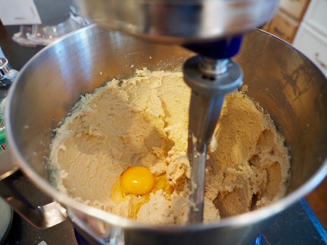 Adding eggs into chocolate chip cookie batter | www.thefreshcooky.com