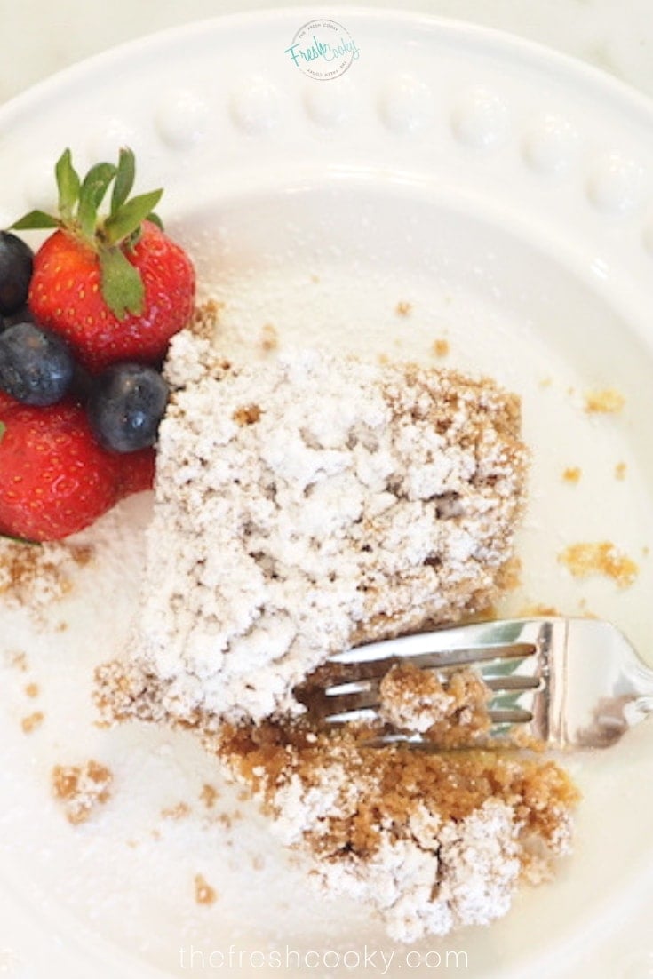 Plated piece of Starbucks Copycat Coffee Cake with a strawberry and fork.