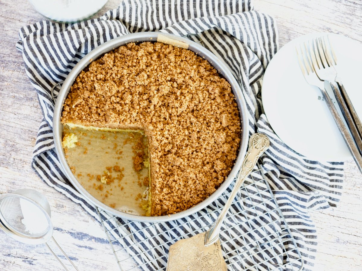 Top view of copycat starbucks coffee cake with a wedge missing.