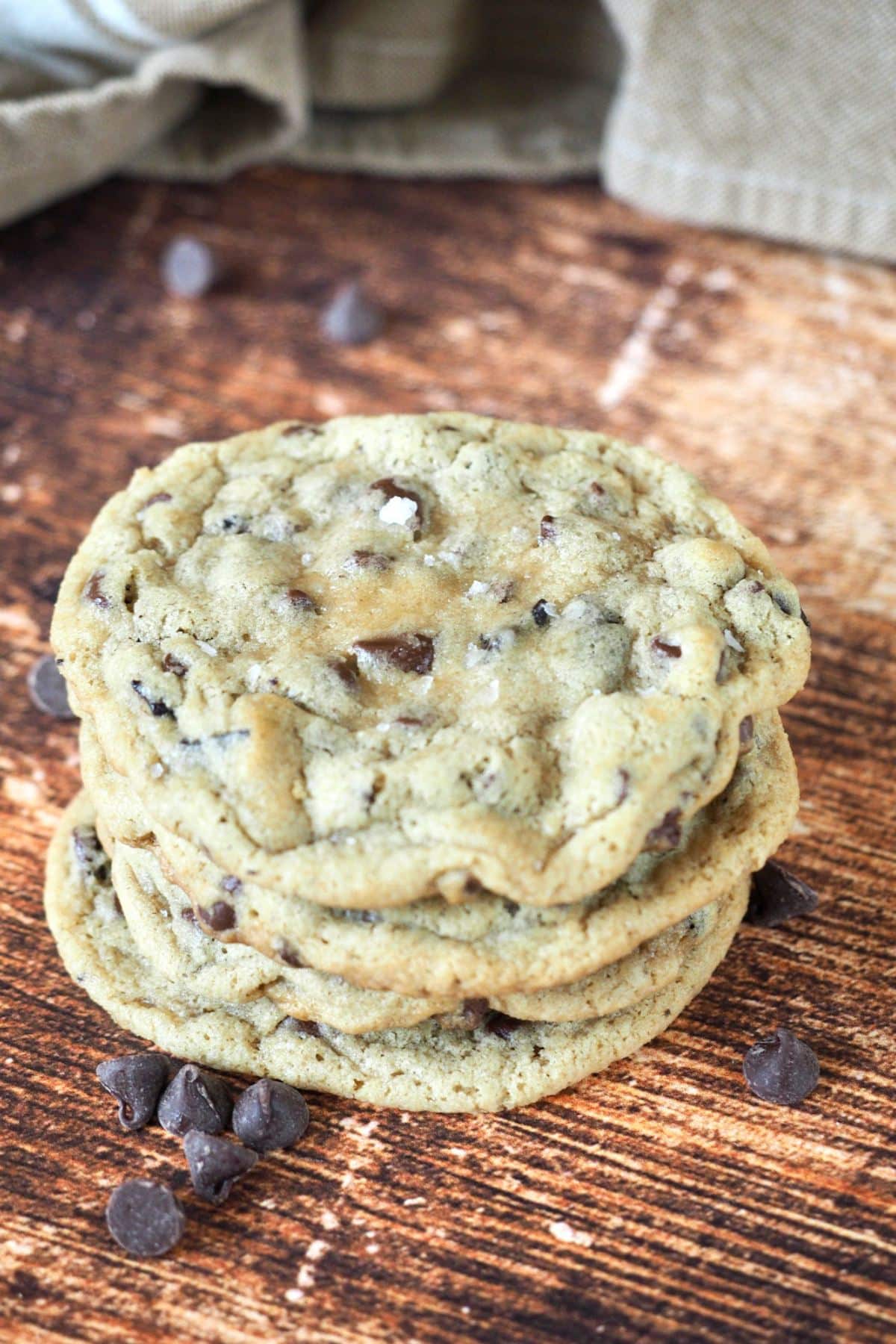 Stack of chewy, thick chocolate chip cookies. 