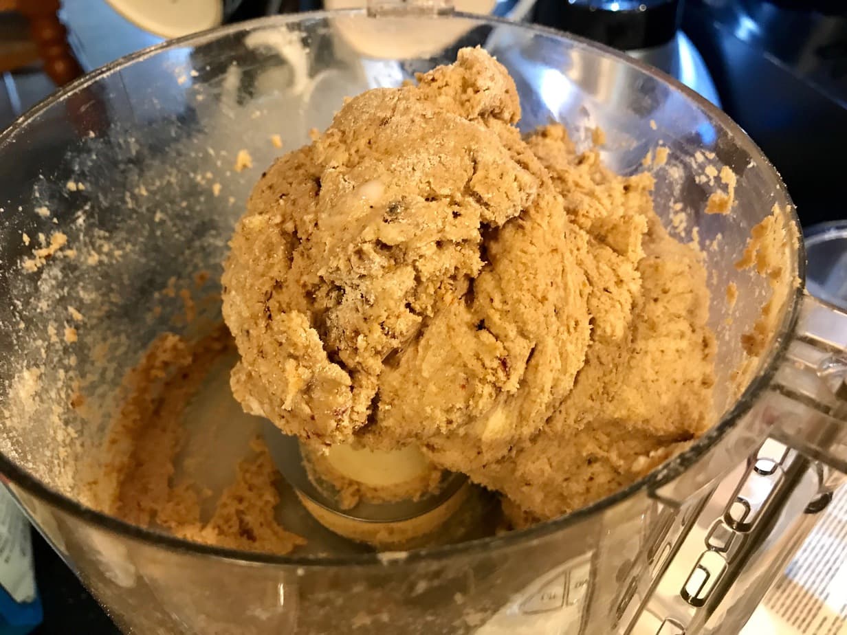 dough in food processor, moist and clumping together. 