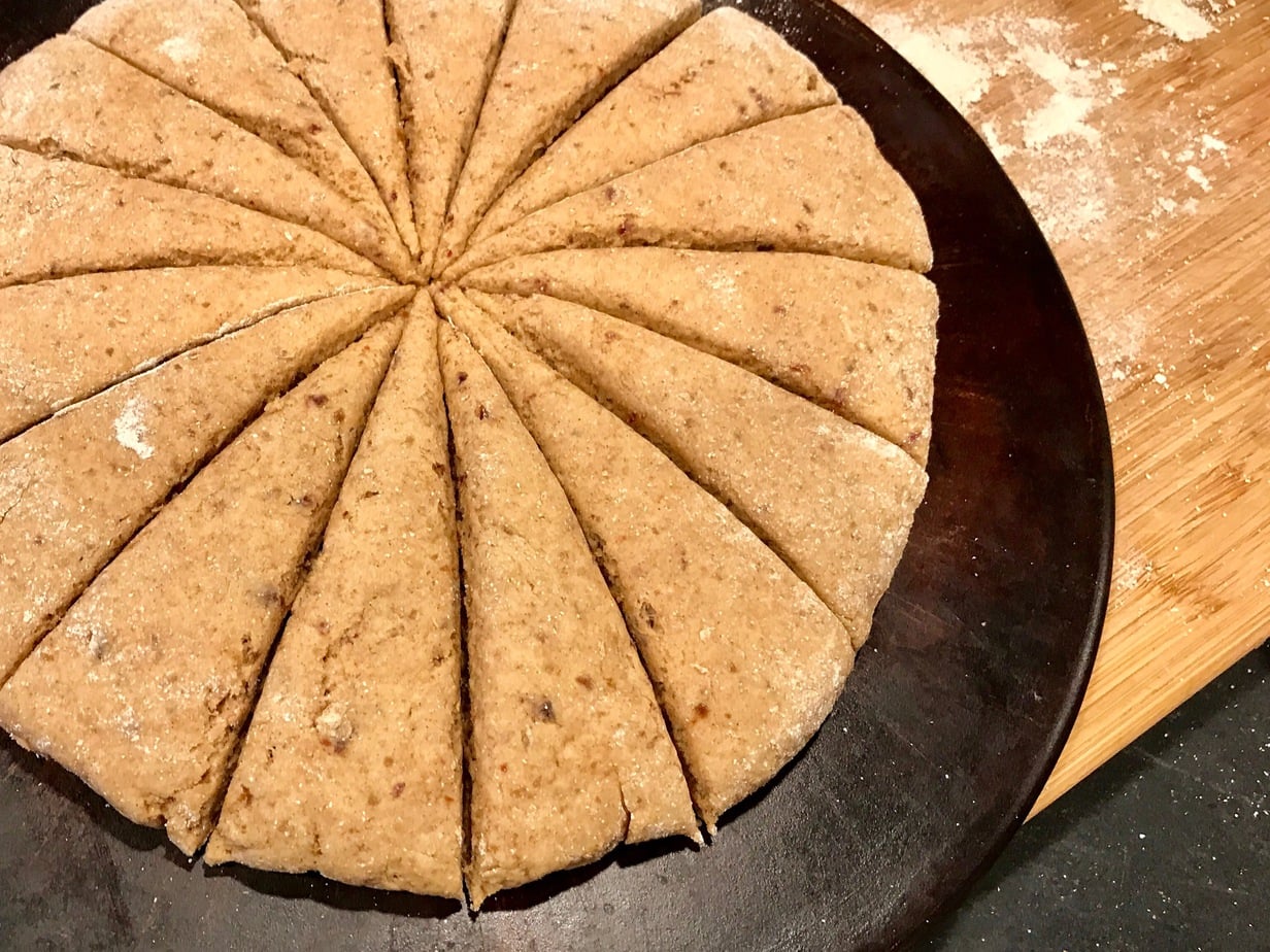 Monster disc of date scones on baking stone.