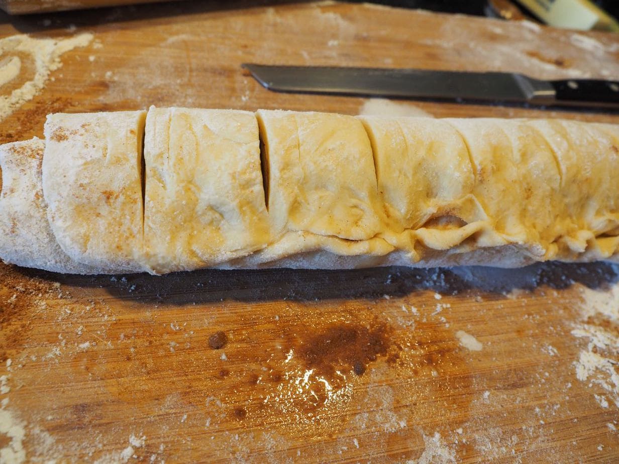 Preslice cinnamon roll log for even slicing. 