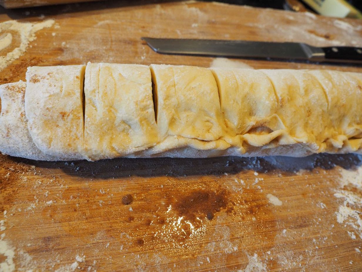 Preslice cinnamon roll log for even slicing.