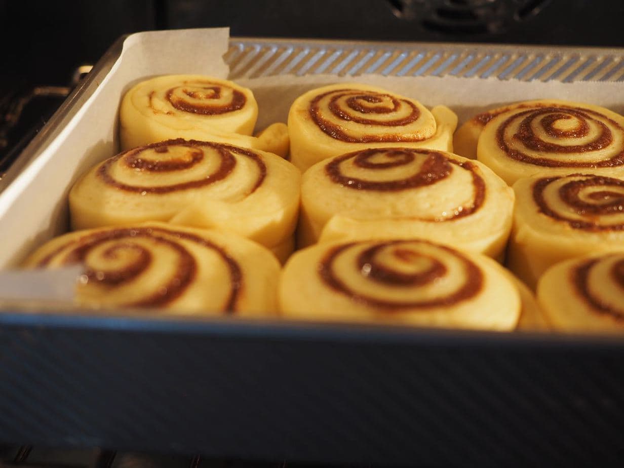 Risen cinnamon rolls ready to be baked. 