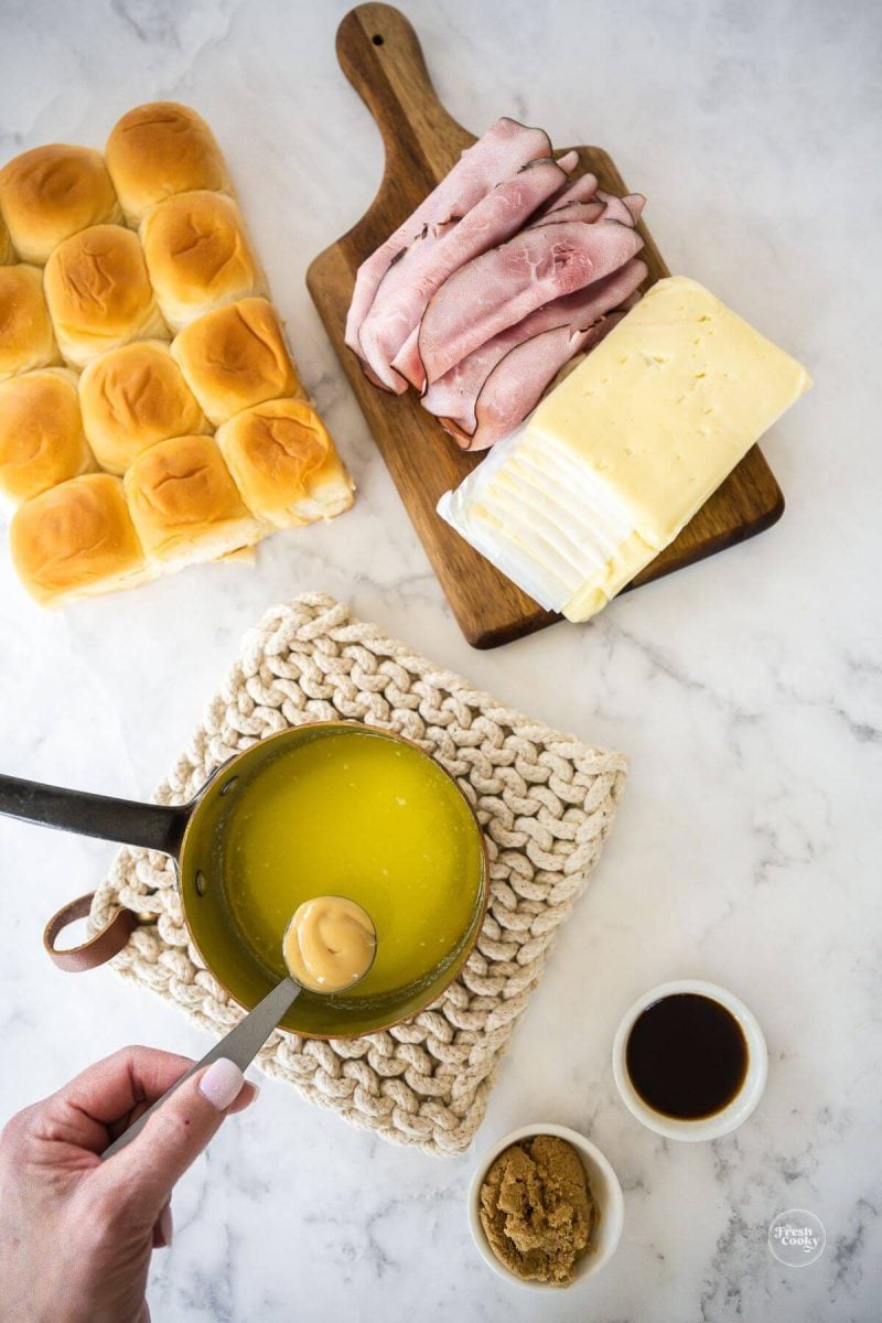 Add Dijon mustard, Worcestershire and brown sugar to melted butter.