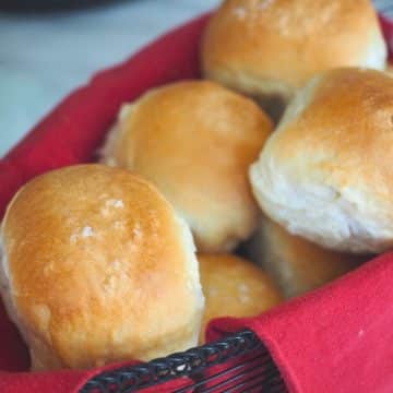 A basket filled with homemade yeast rolls.
