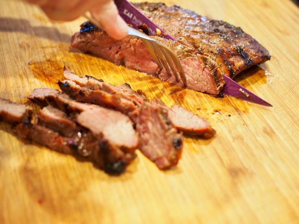 slicing marinated flank steak | www.thefreshcooky.com