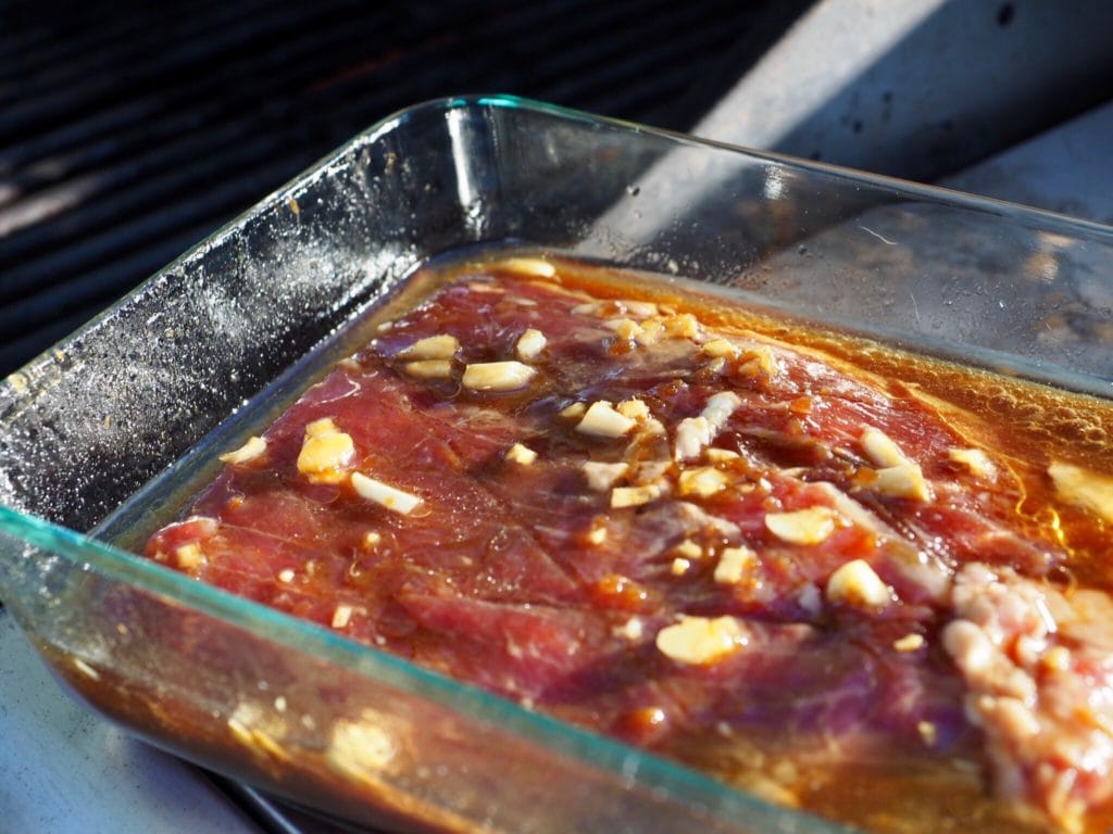 flank steak hanging out in marinade | www.thefreshcooky.com