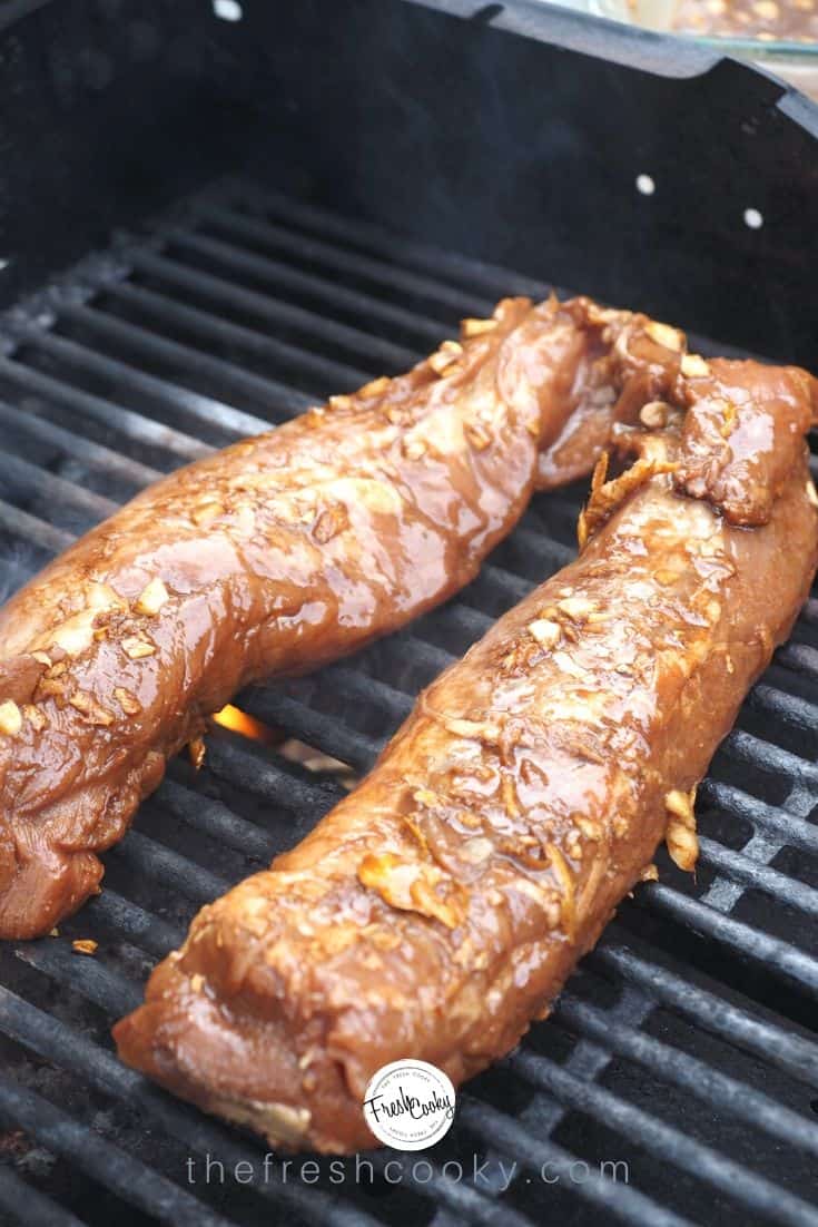 Pork tenderloins in marinade on grill.
