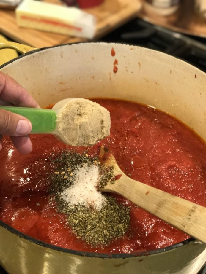 Adding brown sugar to best spaghetti tomato sauce. 