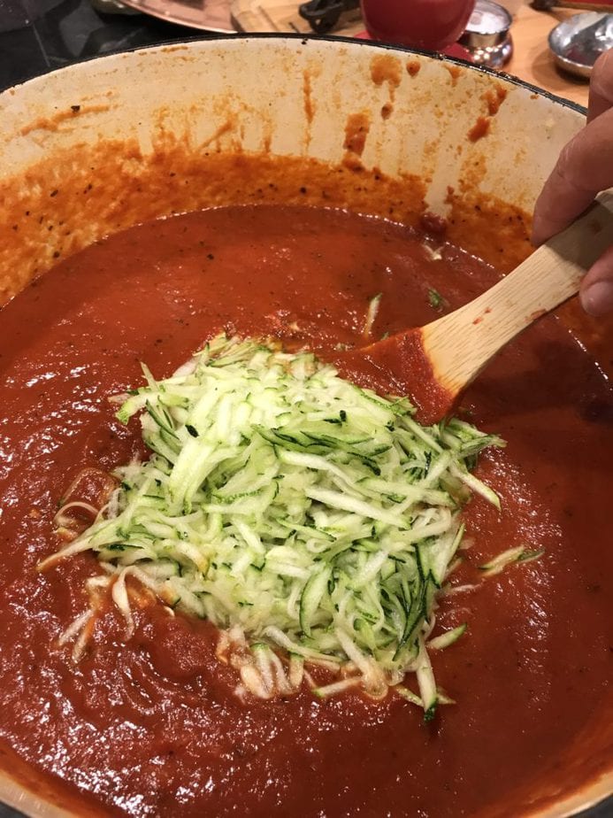 Adding zucchini to Grandpa Frank's Secret best Spaghetti Sauce 
