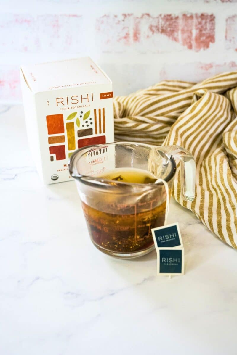 Making hot chai concentrate using Rishi chai tea bags in hot water.