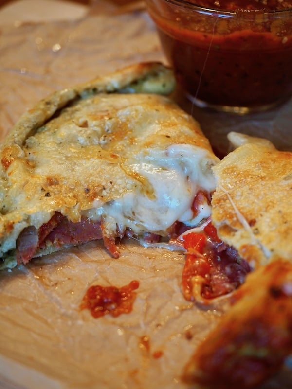 Calzones, inside out pizzas, completely custom, fill them with what you and your family love! Stuff with Pesto, pepperoni, Italian sausage, peppers and onions, artichoke hearts, ricotta and mozzarella cheeses, create your own! A great easy, weeknight meal and alternative to pizza. #thefreshcooky #calzones #meat #vegtarian #pizza #easyweeknightmeal