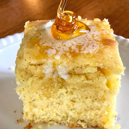 Best Sweet Cornbread Recipe with buttermilk square image with melting butter and a swirl of golden honey.