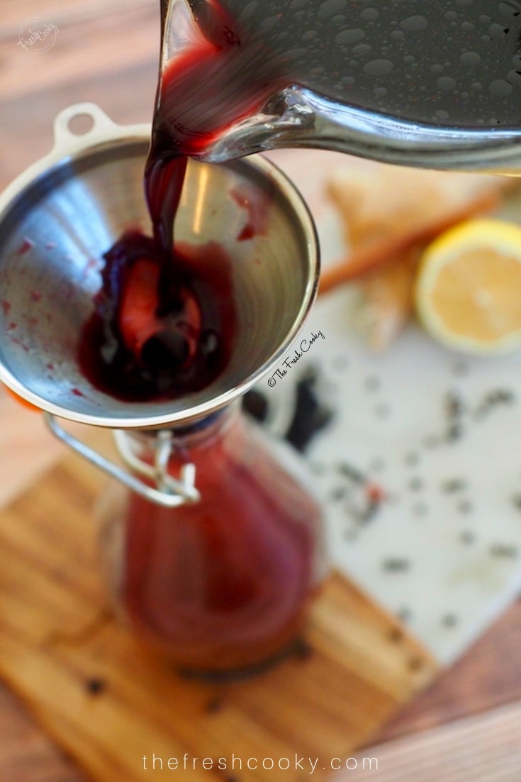 Homemade DIY Elderberry Syrup! Make on the stove top or Instant Pot! Great for preventing colds and flu. We take it at the first sign of flu season and continue to take it daily throughout the winter months. Easy to make, immune boosting syrup. #thefreshcooky #elderberrysryup #elderberries #diy #instantpot 