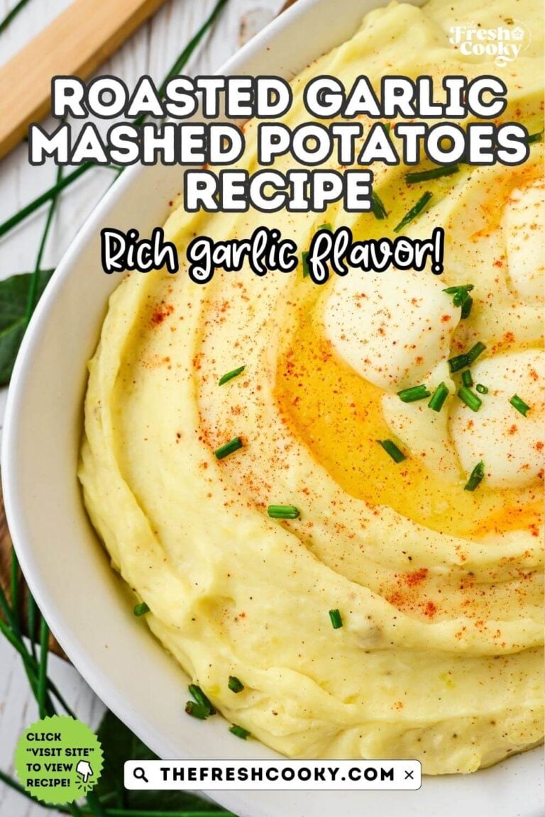 A casserole dish filled with creamy mashed potatoes with garlic, topped with melting pats of butter, chives and paprika, to pin.