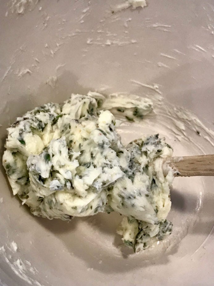 Herbed butter all mixed with small spatula on side of bowl Tender Turkey | www.thefreshcooky.com