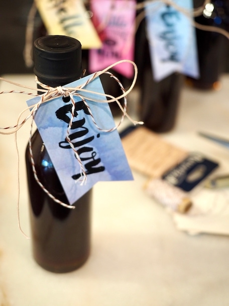 DIY your own Elderberry Syrup gift bottles. Click through for recipe and how to bottle! #thefreshcooky #DIY #bottling #elderberrysyrup #homemade #hostess #gifts #giftsfromthekitchen #giftbottles 