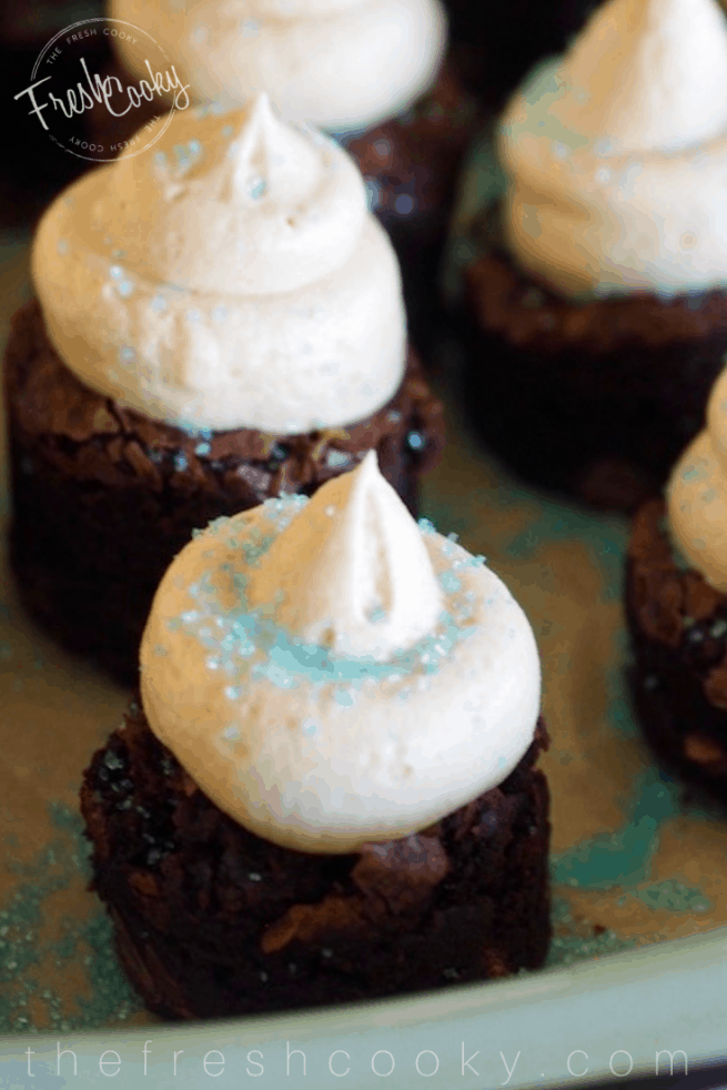 Close up image of espresso brownie bite with kahlua buttercream and blue sprinkles.