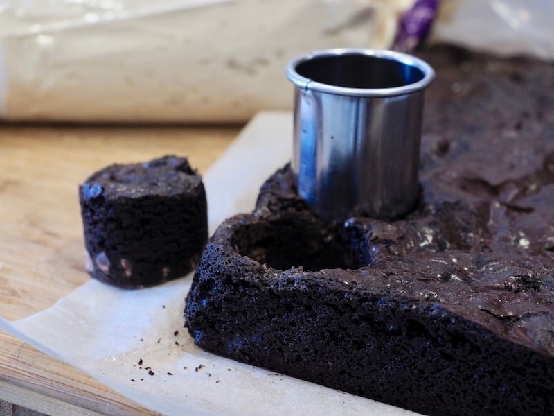 round cookie cutter on top of brownies making "bites"