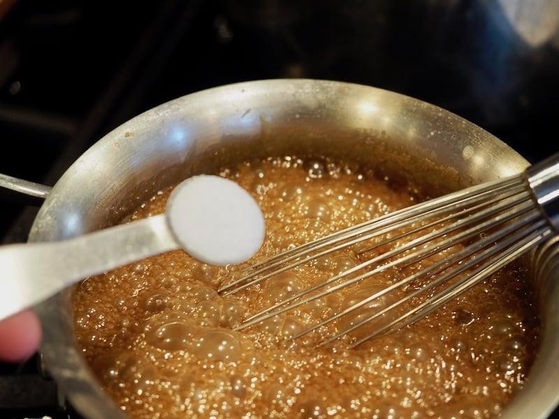 Whisking in the salt for salted caramel sauce