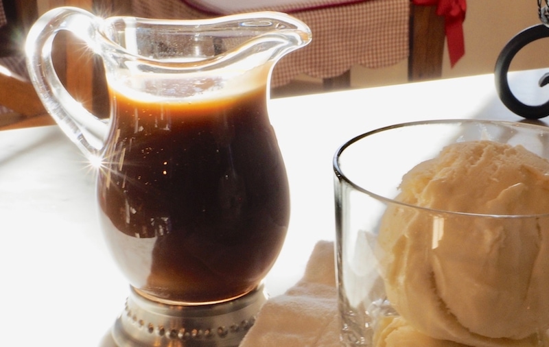 A small pitcher filled with vanilla caramel sauce