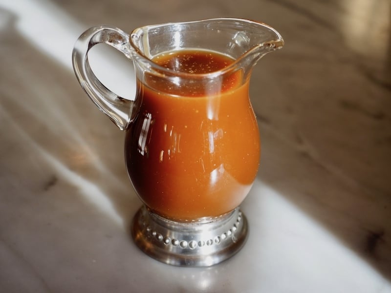 small jar/pitcher of salted caramel bourbon sauce