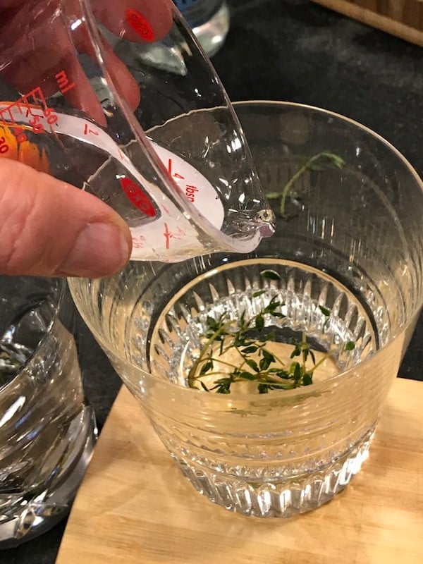 Pouring gin for tangerine and thyme cocktail | thefreshcooky.com