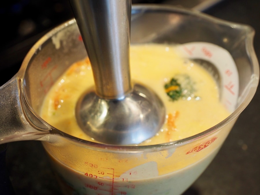 Immersion blender in 2 cup liquid measure blending some of the soup until smooth. 