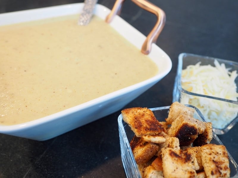 Creamy, healthy, warming and oh-so flavorful cauliflower soup! A great meal chilly evening. Chunks of roasted cauliflower, roasted garlic, seasonings in a chicken broth base blended together and topped with croutons and cheese! #thefreshcooky #cauliflower #soup #creamy #comfortfood