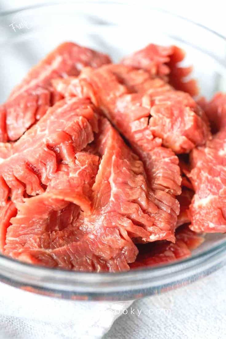 sliced steak, ready for stir fry with beef and broccoli | thefreshcooky.com