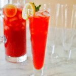 Texas Tea punch recipe square image, with pitcher filled with bright pink tea and a glass poured with texas tea lemonade.