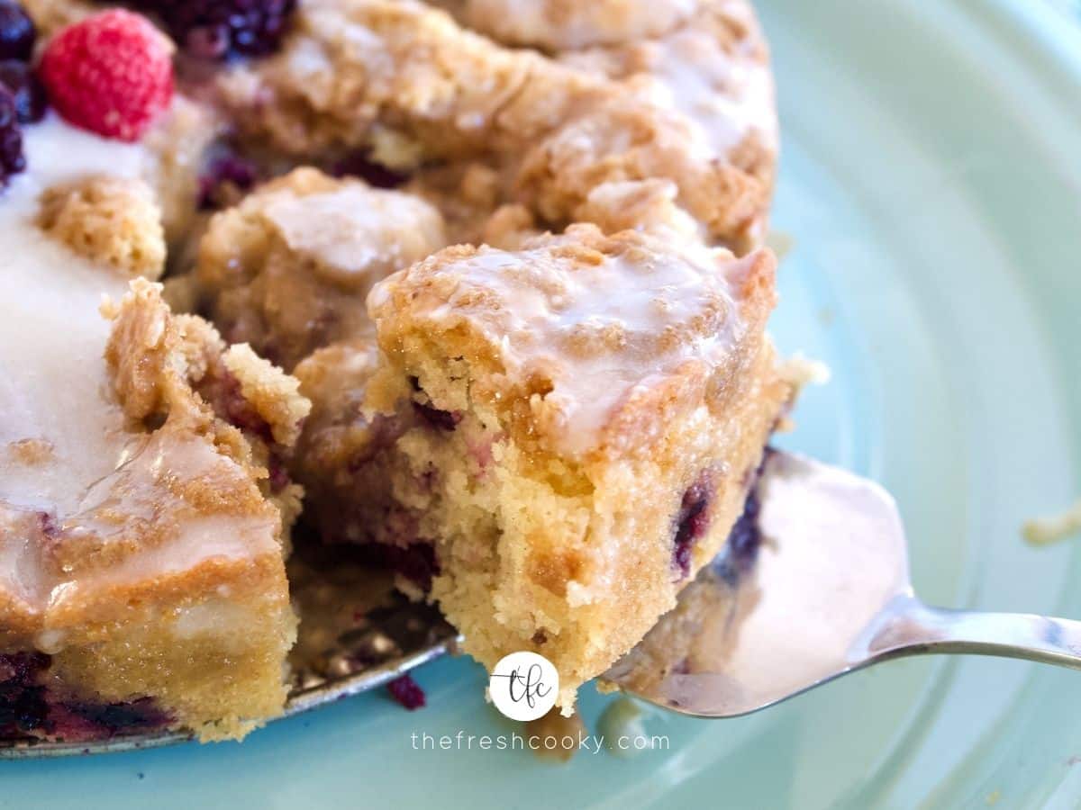 Blueberry Crumb Cake slice being pulled out with pie server.