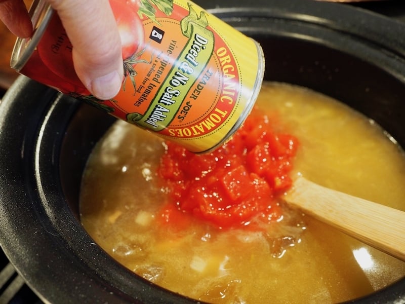 Adding trader joe's organic diced no salt tomatoes.