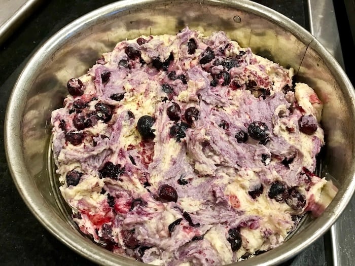 Blueberry cake mixture that used frozen berries that "bled" so batter now is more purple than dough colored in a silver spring form pan. 