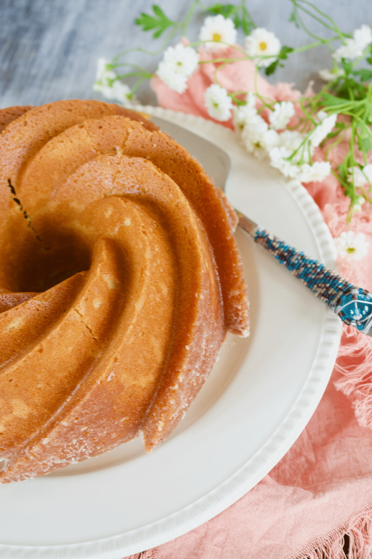 Old fashioned butter pound cake recipe on platter.