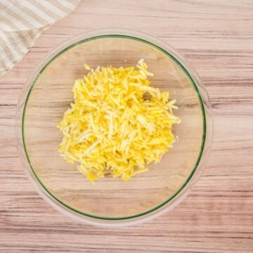 Hash brown crust mixture in bowl.