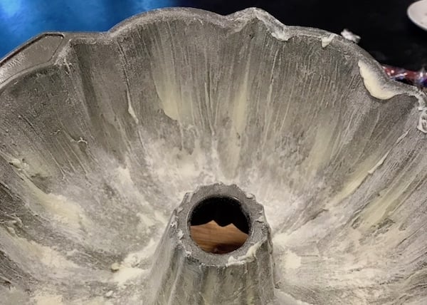 Bundt pan dusted with flour for kentucky butter cake.