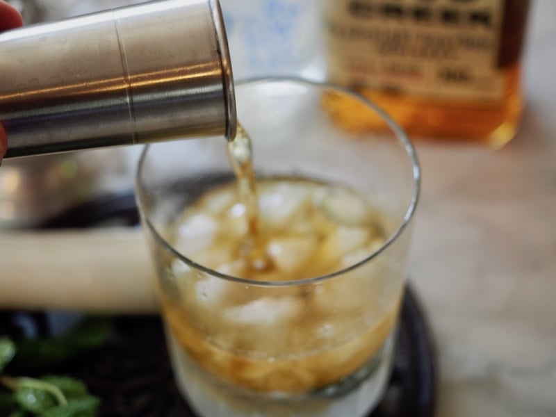 Pouring Bourbon for Cocktail | Mint Julep The Fresh Cooky