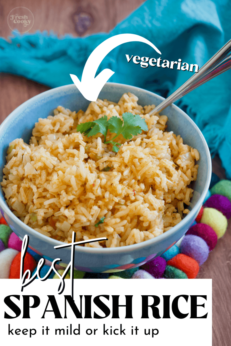 Pin for the best spanish rice recipe, with blue bowl of spanish rice garnished with cilantro. Vegetarian too.