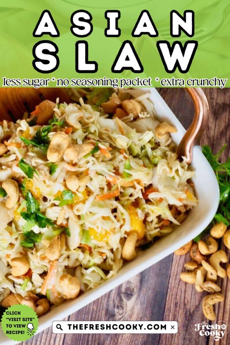 Looking at a large bowl of Asian Slaw with green onions, cilantro, cashews, mandarin oranges in a slaw salad base.