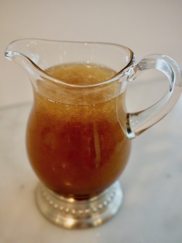 Small pitcher filled with all natural asian dressing.