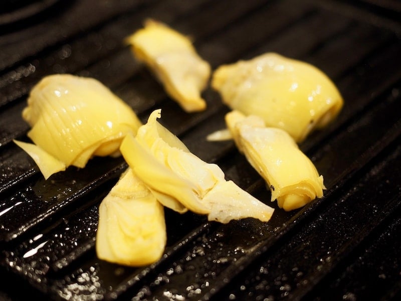 grilling artichoke hearts for chicken shawarma.