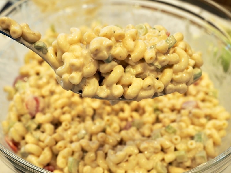 Gigantic spoon of creamy balsamic pasta salad.