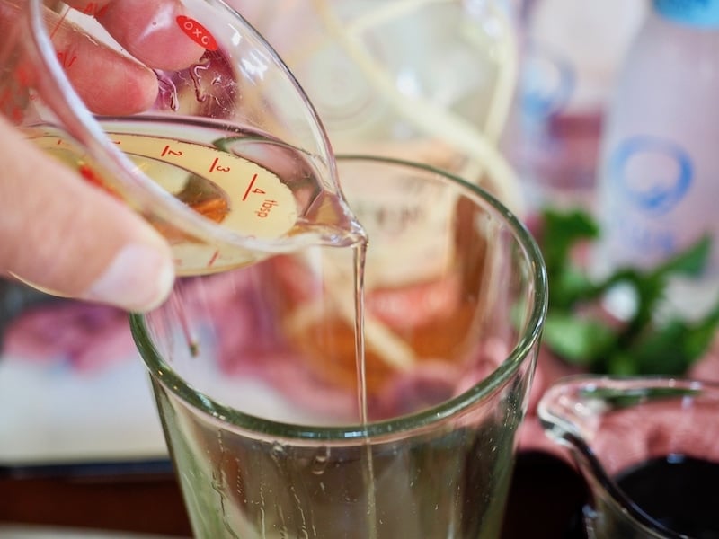 Pouring rum into tall glass