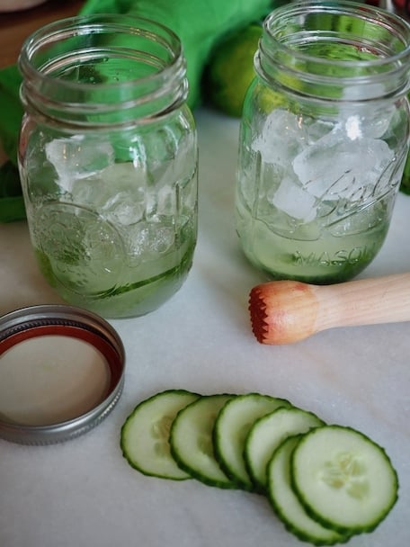 Cucumber Cooler Cocktail ball jars with cucumber slices and ice | www.thefreshcooky.com